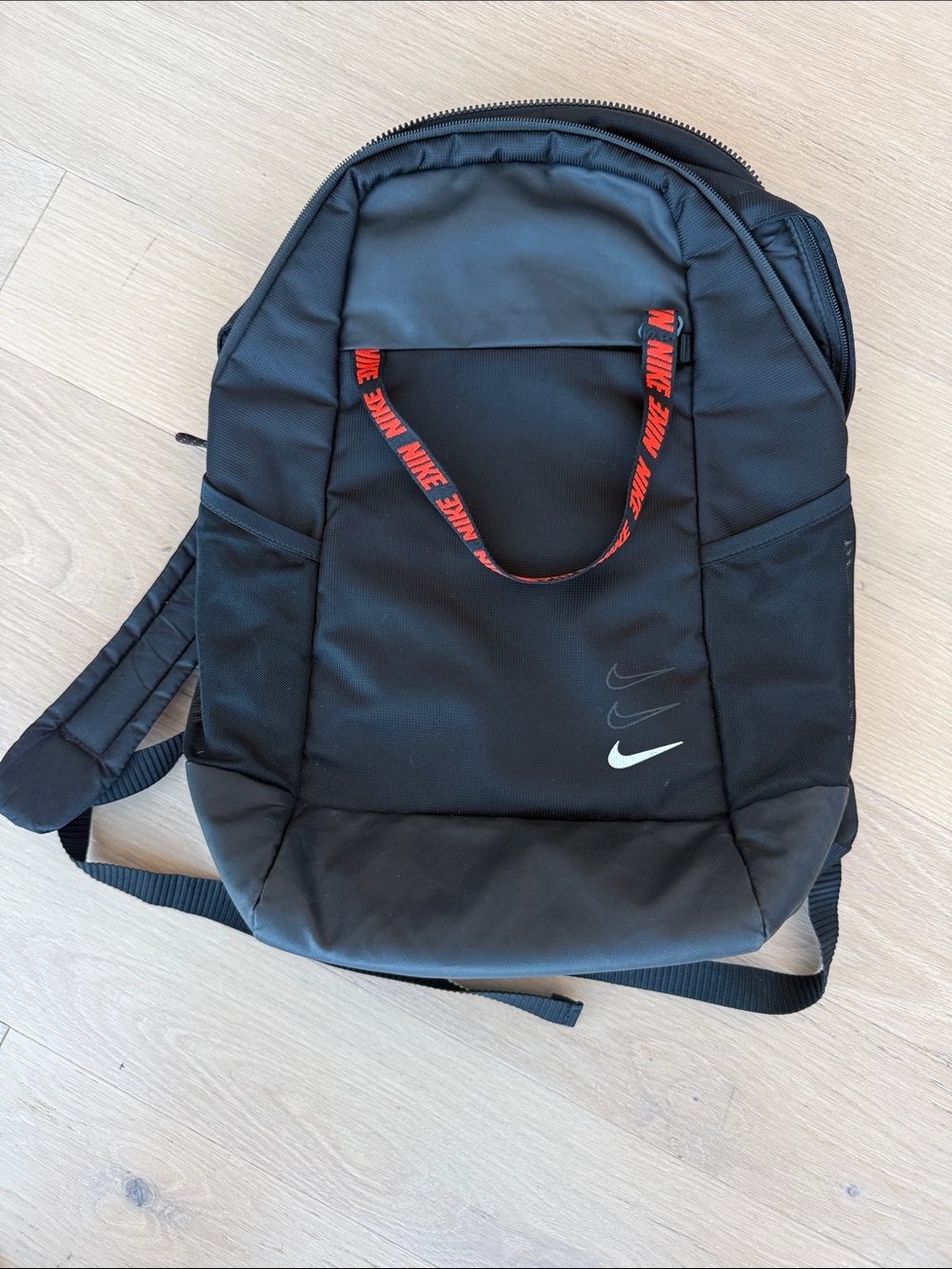 Nike Black Backpack with Red Branded Handle and White Swoosh